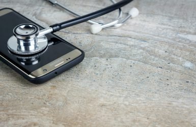 a phone with a stethoscope on top of it