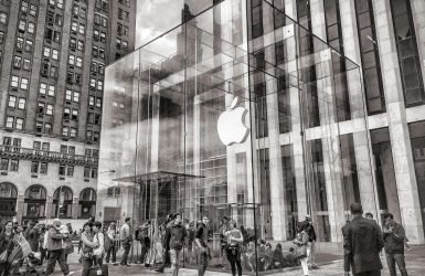 Group of People Walking in Apple Center