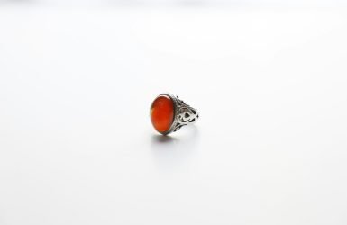 silver and orange stone ring